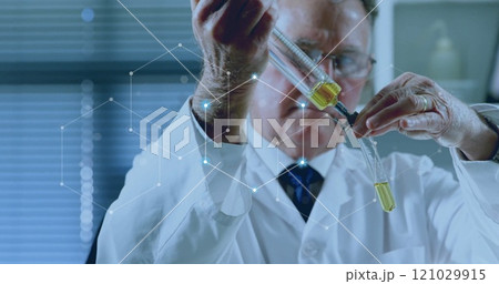 Image of network of connections over caucasian male scientist working in lab Image of network of connections over caucasian male scientist working in lab 121029915