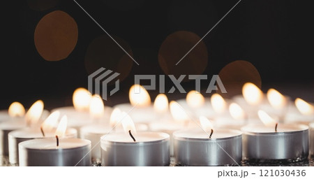 Image of tea lights on black background 121030436