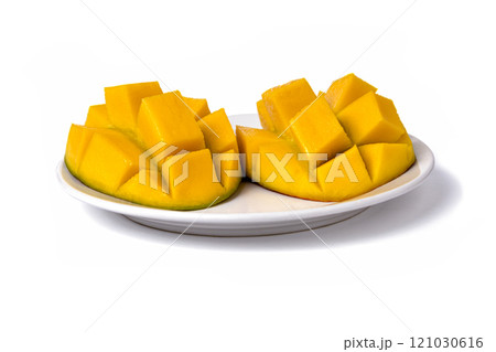 Ripe mangos sliced cut to cubes on a white background, top-side view Ripe mangos sliced cut to cubes on a white background, top-side view 121030616
