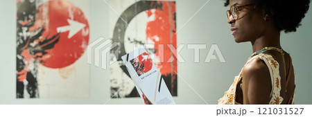 Female visitor of modern art gallery Female visitor of modern art gallery 121031527