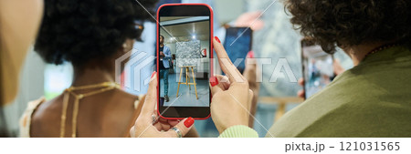 Gallery visitor holding smartphone Gallery visitor holding smartphone 121031565
