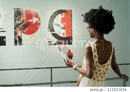 Woman in front of creative artwork 121031656