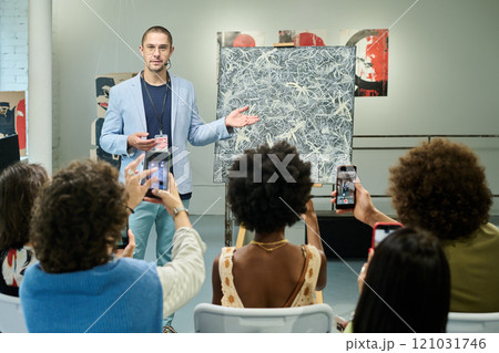 Representing new painting to visitors 121031746