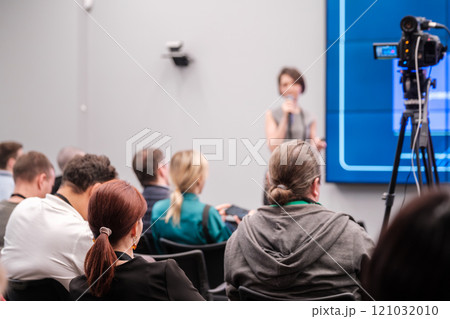 Audience listens to speaker at a professional conference with presentation 121032010