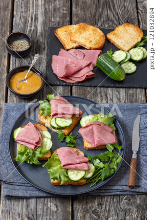 toast with corned beef and veggies, top view 121032894