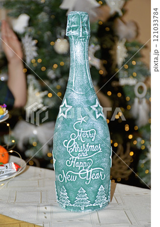 bottle of champagne sparkling wine decorated in Christmas and New Year style bottle of champagne sparkling wine decorated in Christmas and New Year style 121033784