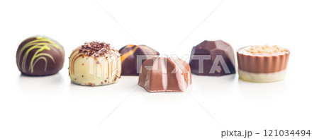 Mix of chocolate pralines isolated on white background. 121034494