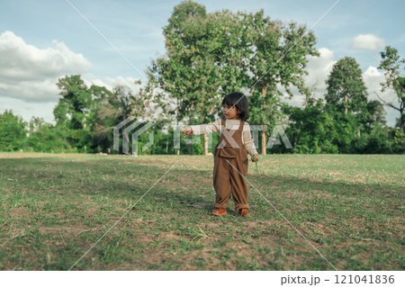 happy toddle baby girl on grass field happy toddle baby girl on grass field 121041836