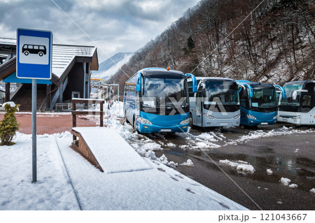 Bus station near the mountain forest at winter Bus station near the mountain forest at winter 121043667