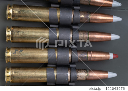 .50 BMG caliber machine gun ammunition belt with cartridges in ammunition can. .50 BMG caliber machine gun ammunition belt with cartridges in ammunition can. 121043976