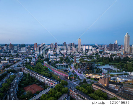 Captivating aerial view of rotterdam's cityscape featuring Museumpark and Depot Boijmans Van Beuningen, showcasing modern architecture during the blue hour Captivating aerial view of rotterdam's cityscape featuring Museumpark and Depot Boijmans Van Beuningen, showcasing modern architecture during the blue hour 121046685