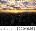 Manila city skyline with skyscrapers and buildings glowing in the golden sunset with clouds and sunbeams. Aerial view of an Asian metropolis. 121046861