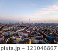 Golden hour sunset over Berlin cityscape with iconic landmarks and residential buildings, creating a stunning urban landscape in Germany Capital 121046867
