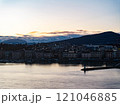 Mesmerizing sunrise over Lake Geneva with majestic Alps and vibrant clouds, creating a picturesque scene in Switzerland, Europe 121046885