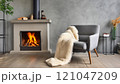 Cozy Modern Living Room with Fireplace and Armchair 121047209