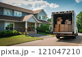 Moving Truck With Boxes Outside a Suburban House 121047210