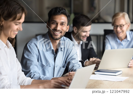 Colleagues working together, engaged in project discussion, office portrait 121047992