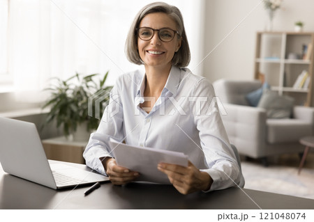 Happy beautiful grey haired mature business woman in elegant eyeglasses Happy beautiful grey haired mature business woman in elegant eyeglasses 121048074
