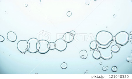 Clear water bubbles floating in liquid, close-up view of transparent bubbles in water, abstract background with air bubbles, fresh and clean water, purity and freshness concept 121048520