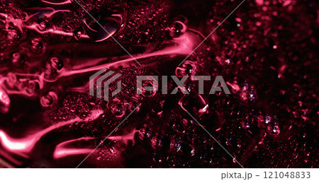 Red condense. Glossy wetness. Mystery shiny area covered with defocused flowing water drops foil effect. Smooth condensation background texture. Red condense. Glossy wetness. Mystery shiny area covered with defocused flowing water drops foil effect. Smooth condensation background texture. 121048833