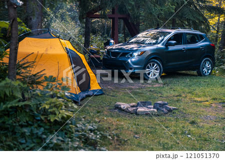 Serene Camping Scene in a Lush Forest 121051370