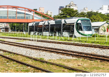 The circular light rail train drives past Hamasen Railway Cultural Park in Kaohsiung, Taiwan. 121052757