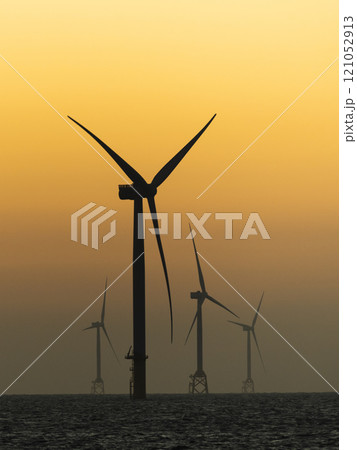 Sunset view of the Offshore wind power systems off the western coast of Taiwan. Sunset view of the Offshore wind power systems off the western coast of Taiwan. 121052913