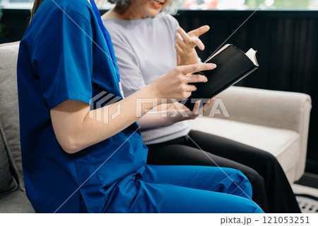 Caregiver doctor examine older patient use blood pressure gauge. woman therapist nurse at nursing home taking care of senior elderly woman Caregiver doctor examine older patient use blood pressure gauge. woman therapist nurse at nursing home taking care of senior elderly woman 121053251