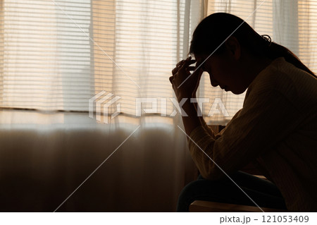 Silhouette depressed young asian woman with mental health problem in mind need crucial treatment from overthinking fatigue girl, disruptive thought, dissocial, anxiety and mental health disorders. 121053409