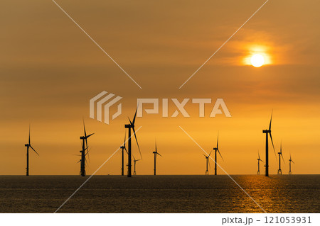 Sunset view of the Offshore wind power systems off the western coast of Taiwan. Sunset view of the Offshore wind power systems off the western coast of Taiwan. 121053931