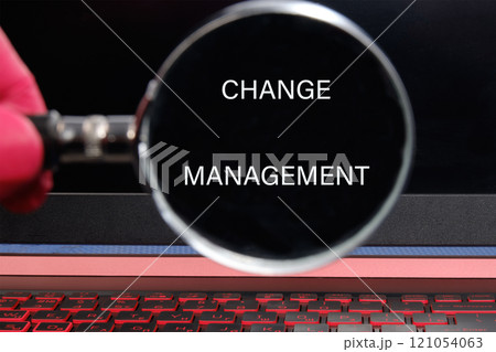 development and career growth or change yourself concept. CHANGE MANAGEMENT through a magnifying glass on a black background development and career growth or change yourself concept. CHANGE MANAGEMENT through a magnifying glass on a black background 121054063