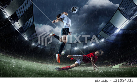 Female soccer player jumping gracefully to strike ball mid-air, captured in rain-soaked 3D-modeled stadium during competitive soccer match. 121054333