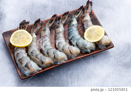 Raw big tiger ( king ) shrimps Cleaned, Peeled & Deveined photography . Top view 121055851