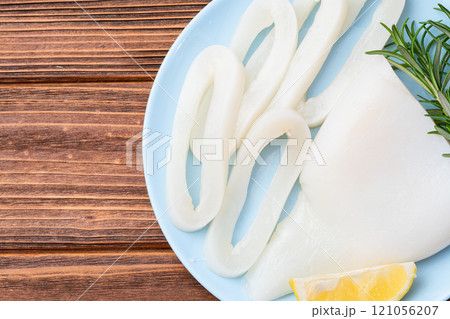 Squid tube and ring photography . Seafood top view 121056207