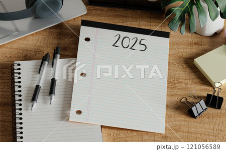 2025 lined paper and stationery on wooden desk, 3D render. 121056589