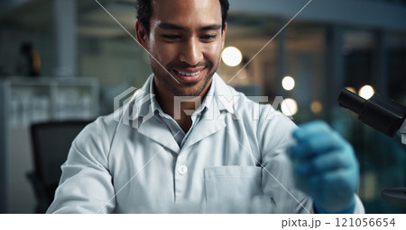 Science, man or smile in lab for research, experiment process or healthcare study at night. Scientist, happy or test in facility for pharmaceutical development, engineering deadline or investigation 121056654