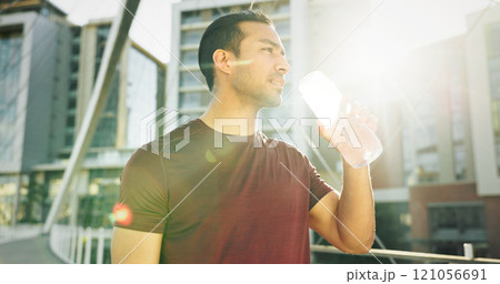 Man, drinking water and athlete thinking in city, liquid nutrition and sports drink for fitness. Male person, sun flare and bottle of h2o for refreshing rest in urban town, dream and exercise goals 121056691