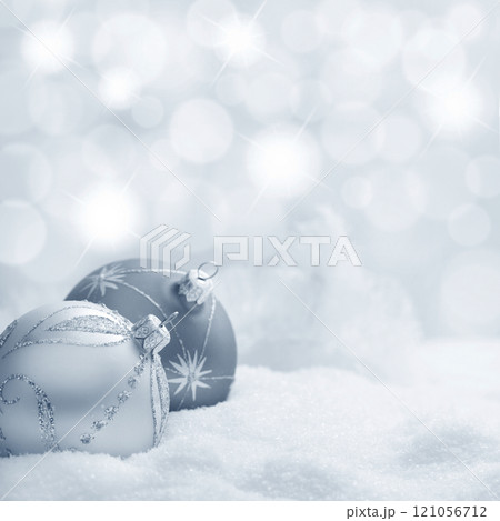 Christmas balls in snow 121056712