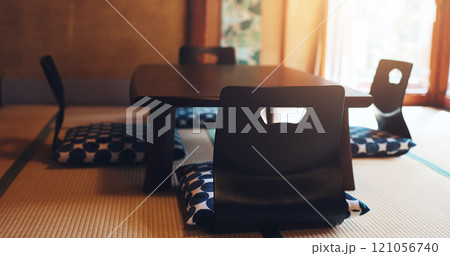 Dining, furniture and Japanese decor with floor chair with Asian culture for interior design in house. Chabudai, empty room and minimal Japan style with wood table and mat with seat and tradition 121056740