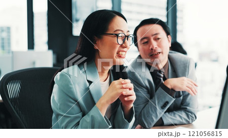 Japanese, business people and collaboration in office for feedback, review and teamwork for project. Woman, man and together for partnership, conversation and career in management for finance company 121056815