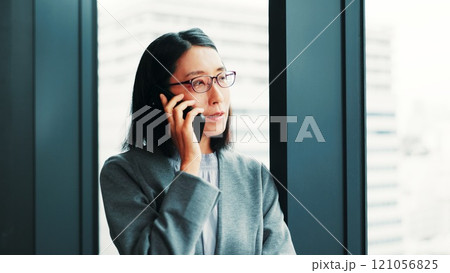 Japanese, business and woman with phone call in office of talking, planning project and schedule update. Mature accountant, mobile and discussion, finance proposal and investment negotiation in Japan 121056825