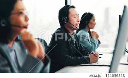 Virtual assistant, telecom or Japanese man on computer in call center for consulting, online help or loan advice. Coworking, consultant or agent with service for telemarketing or sales communication Virtual assistant, telecom or Japanese man on computer in call center for consulting, online help or loan advice. Coworking, consultant or agent with service for telemarketing or sales communication 121056838