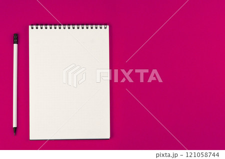 A notebook with an even spring at the top with white pages and a white pencil with a gray lead and a black eraser lie on a pink background on the left with space for text. High quality photo A notebook with an even spring at the top with white pages and a white pencil with a gray lead and a black eraser lie on a pink background on the left with space for text. High quality photo 121058744