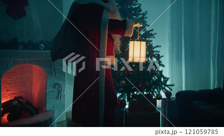 Santa Claus enters the house on Christmas Eve Santa Claus enters the house on Christmas Eve 121059785