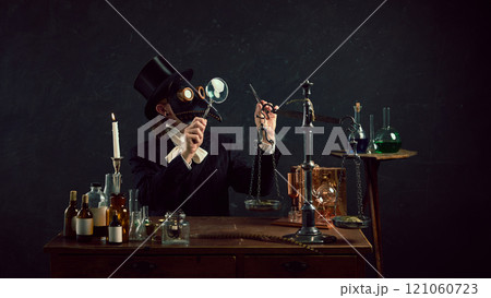 Alchemist-inspired plague doctor immersed in work, balancing old-fashioned scales in vintage laboratory against dark mystery background. Alchemist-inspired plague doctor immersed in work, balancing old-fashioned scales in vintage laboratory against dark mystery background. 121060723