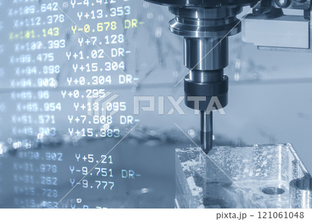 Abstract scene the CNC milling machine chamfer cutting aluminum part and G-code data background in the light blue scene. Abstract scene the CNC milling machine chamfer cutting aluminum part and G-code data background in the light blue scene. 121061048