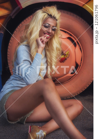 Stylish Woman Eating Snack 121061796