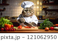 シェフになった猫が台所で野菜を切っている 121062950
