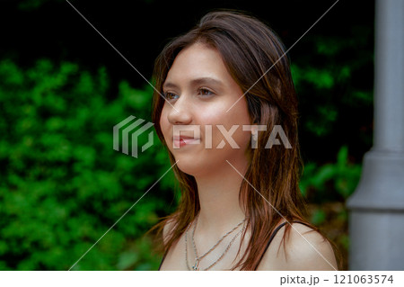 Portrait of a Young Woman Outdoors Portrait of a Young Woman Outdoors 121063574