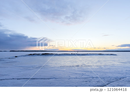 Winter landscape with frozen Baltic sea coast at sunset Winter landscape with frozen Baltic sea coast at sunset 121064418
